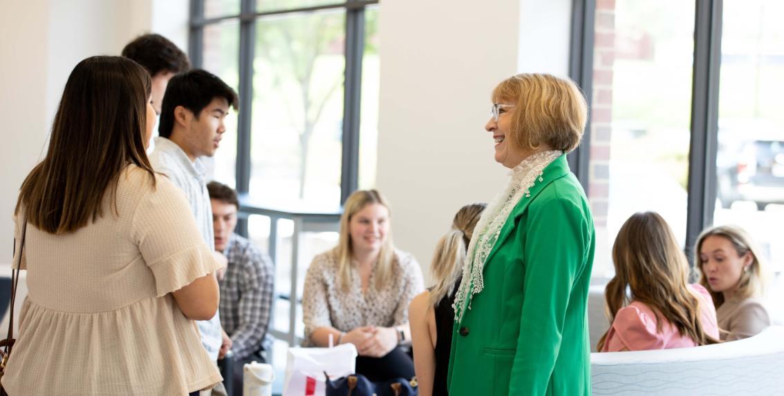 Patti Carey connecting with students at a business school event
