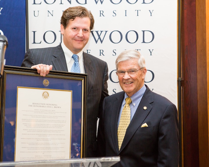 President Reveley with the resolution honoring Otis Brown