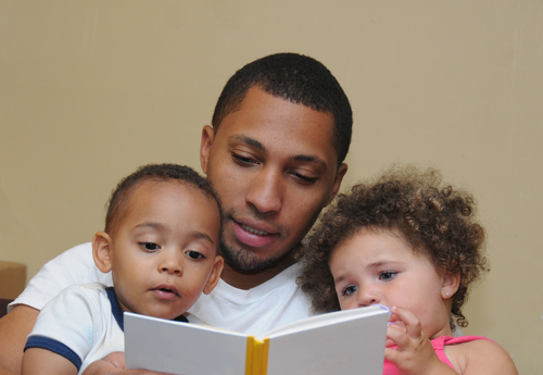 Dad reading to children