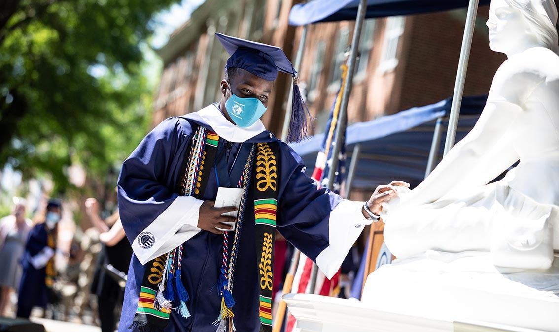 In a first for Longwood ceremonies, the Class of 2021 was invited to touch Joan of Arc—a longstanding good-luck tradition—as they received their diplomas.