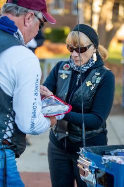 Mark and Alison Kendrick, both veterans, putting the Ground Zero flag into its case for transport to the next destination.